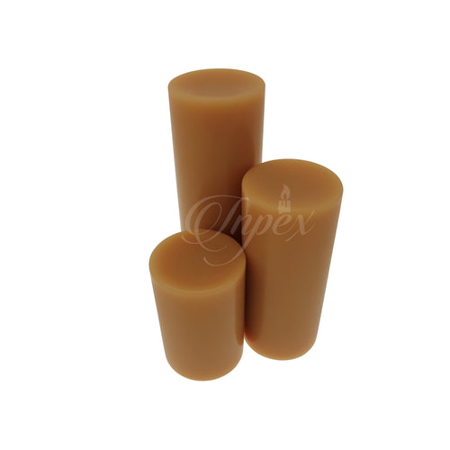 Three antique ivory coloured pillar candles on a white background with 'Inpex' watermark.